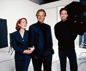 : THE X-FILES, from left: Gillian Anderson, Chris Carter, David Duchovny, (1997), 1993-2018