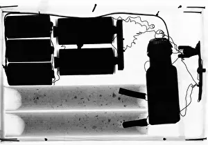 Dynamite Prints: X-ray of bomb. An innocent appearing square package