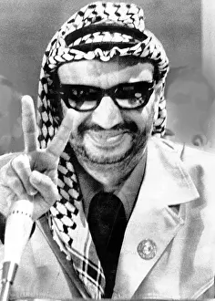 Head Wrap Prints: Yasser Arafat flashes victory sign at the final session of the Seventh Arab Summit Conference