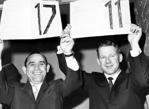 Contract Prints: Yogi Berra and Whitey Ford hold up their 17th and 11th contracts with the Yankees