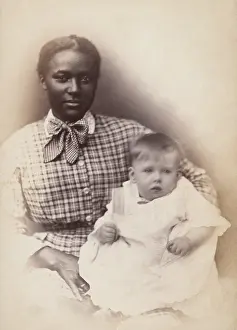 Worker Prints: Young African American woman holds a white baby