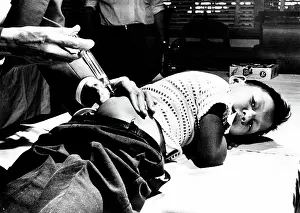 Medical Prints: Young boy receives vaccination in St