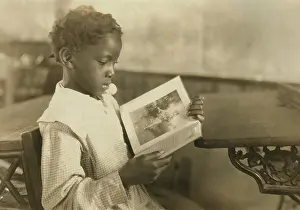 West Virginia Prints: Young girl reading an illustrated book in Pleasant Green School