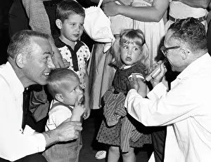 1960s Candids Prints: A young girl receiving a vaccine, circa 1960. Courtesy: CSU Archives/Everett Collection