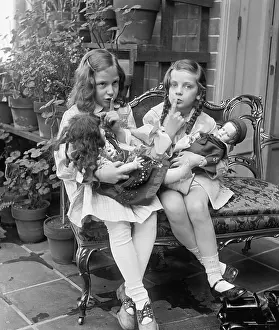 Vicinity Prints: Two young girls with dolls, ca