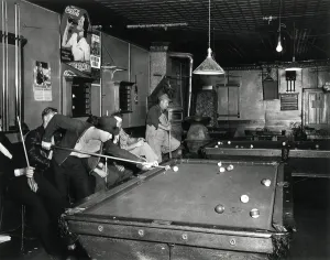 Advertisement Prints: Young men playing pool on a weeknight in Shelby County, Iowa. May 1941. (BSLOC_2013_8_107)