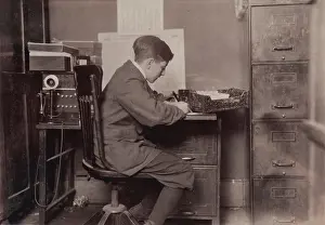 Images Dated 25th June 2008: Young office boy, working for J