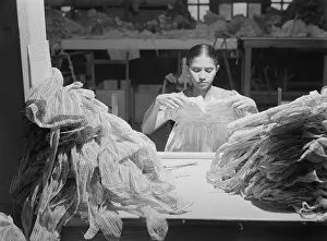 Inspecting Prints: Young Puerto Rican women working in a clothing factory
