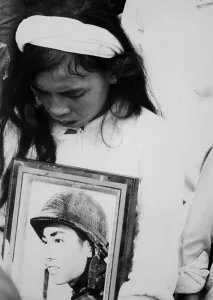 War Victims Prints: An young Vietnamese widow mourns