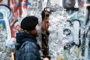 Communism Prints: A young West German woman speaks with an East German guard through an opening in the Berlin Wall