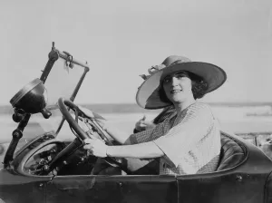 Coupe Prints: Young woman at steering wheel of automobile. 1921. LC-USZ62-100382
