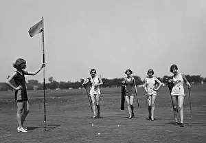 Bathing Suits Prints: Young women in bathing suits golfing in Washington