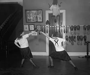 Exercise Prints: Young women in bloomers and middy shirts fencing