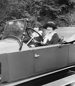 Open Prints: Young women driving a convertible in Washington, D.C. Ca. 1920. (BSLOC_2015_16_233)