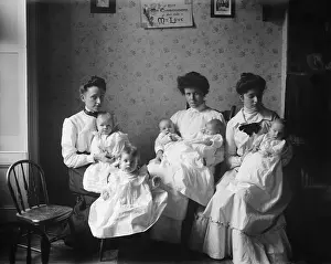 Charity Prints: Three young women hold five babies at the Childrens Aid Society