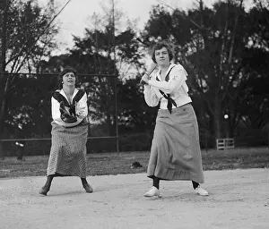 Batting Prints: Young women playing baseball in middy shirts and long skirts in 1919