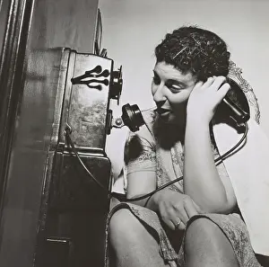 Communication Prints: Young women on the public telephone installed in a Washington