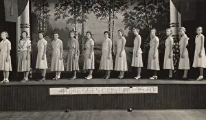 On Stage Prints: Young women on stage modeling dresses at a 4-H Club event