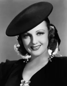 Grey Prints: YOUTH TAKES A FLING, Virginia Grey, modeling a black felt pancake hat by Vera West, 1938