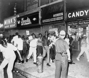 Riots Prints: Youthful crowd chanting along the sidewalk on 125th St